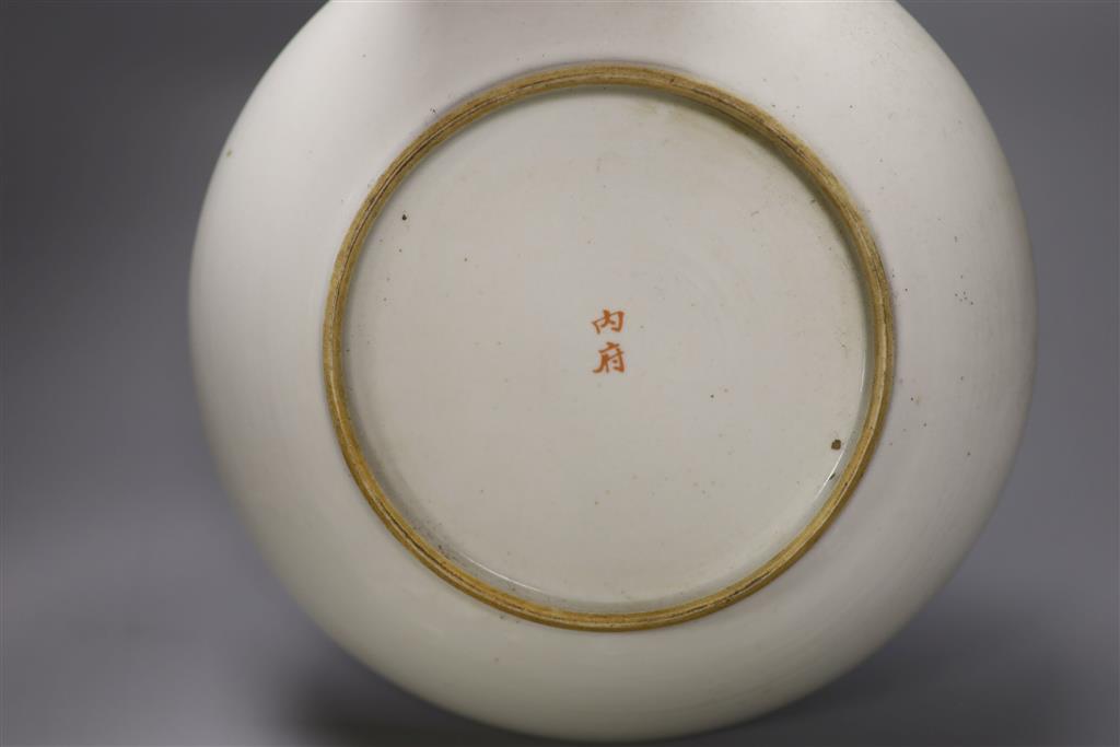 A large Chinese famille rose saucer dish and two similar small dishes, diameter of largest 22.5cm